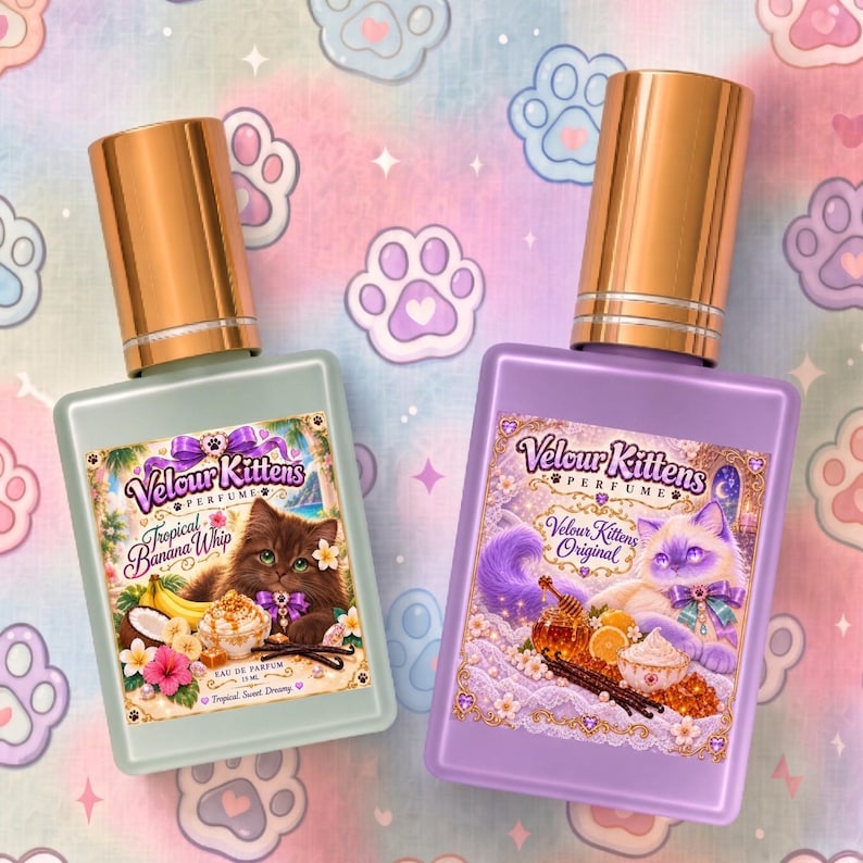 May include: Two rectangular glass perfume bottles with metallic gold caps. The left bottle is light green with a label featuring a brown kitten and the text Velour Kittens Tropical Banana Whip. The right bottle is purple with a label featuring a white kitten and the text Velour Kittens Original.