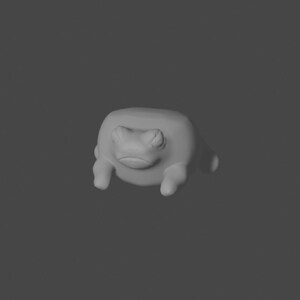 May include: A gray, 3D-printed frog figurine with a simple, cartoonish design. The frog has a wide, flat body and large, round eyes.