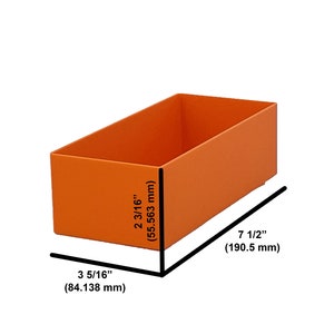 May include: An orange rectangular storage box. The box is 190.5 mm long, 84.138 mm wide, and 55.563 mm high. The box is empty and has a simple, clean design. The dimensions are provided in millimeters.