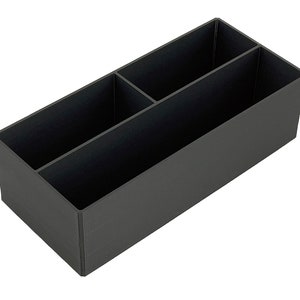 May include: A black plastic desk organiser with three compartments.