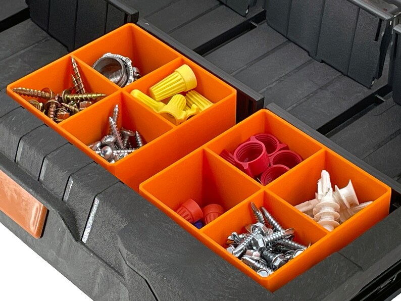 May include: A black plastic toolbox with orange dividers. The toolbox is filled with various small hardware items, including screws, nuts, bolts, and wire connectors.