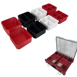 May include: Assortment of red, black, and white plastic storage containers with dividers. The containers are stacked on top of each other. A larger red storage container with dividers is open and visible.