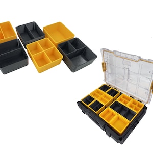 May include: A set of yellow and black plastic storage containers with dividers. The containers are designed to fit into a larger storage box with a clear lid. The box has a black base and yellow accents.