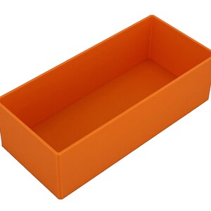 May include: An orange rectangular box with a simple, open design. The box is empty and has a matte finish. The sides are straight and the corners are squared. The box is made of a solid material.