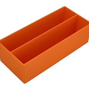 May include: An orange rectangular organiser with two compartments. The organiser is made of a solid material and is designed to hold items. The compartments are separated by a vertical divider.