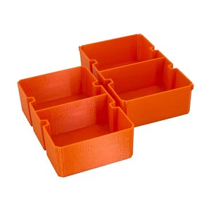 May include: Four orange plastic storage bins, each with a rectangular shape and open top. The bins are interlocked, creating a modular storage system. The bins are made of a textured plastic.
