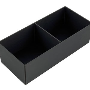 May include: A black rectangular storage box with two compartments. The box is made of a sturdy material and has a smooth finish.