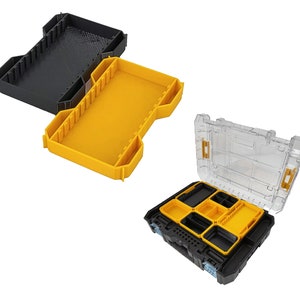 Könnte beinhalten: Drei Kunststoff-Aufbewahrungsboxen. Eine schwarze, eine gelbe und eine transparente mit schwarzem Sockel und gelben Einsätzen. Die Organizer haben mehrere Fächer und sind für Werkzeuge oder Kleinteile konzipiert.