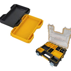 May include: An open yellow and black plastic tool box with multiple compartments. The lid is clear plastic and the box has a handle.