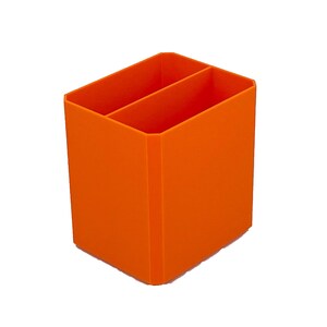 May include: Bright orange desk organizer with two compartments. The rectangular container is made of a solid material and is designed to hold pens, pencils, or other office supplies. The organizer is shown against a white background.