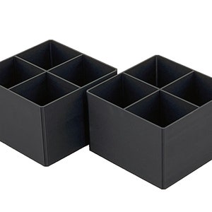 May include: Two black plastic storage boxes with four compartments each. The boxes are empty and have a square shape.
