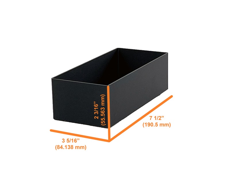 May include: Black rectangular storage box with measurements in inches and millimetres. The box is 3 5/16 inches (84.138 mm) wide, 2 3/16 inches (55.563 mm) tall, and 7 1/2 inches (190.5 mm) long.