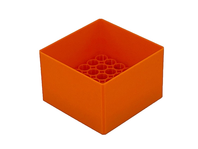 May include: Orange plastic storage box with a honeycomb-like design inside. The box is empty.