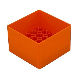 May include: Orange plastic storage box with a grid of circular holes in the bottom. The box is empty.