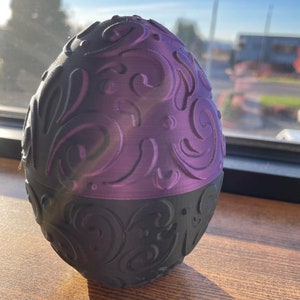 Huevo de dragón: almacenamiento de dados y joyas