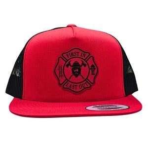 May include: Red and black trucker hat with a black embroidered patch that says "First In Last Out" with a firefighter helmet and crossed axes inside a fire department symbol.