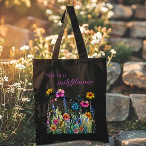She is a wildflower, The Daisy Exchange, Gifts for her, bestie gifts, birthday gifts, best selling items, bridesmaid tote, embroidered tote, floral backpack, weekend bag, christian tote, farmers market bag, floral botanical canvas bag, everyday tote