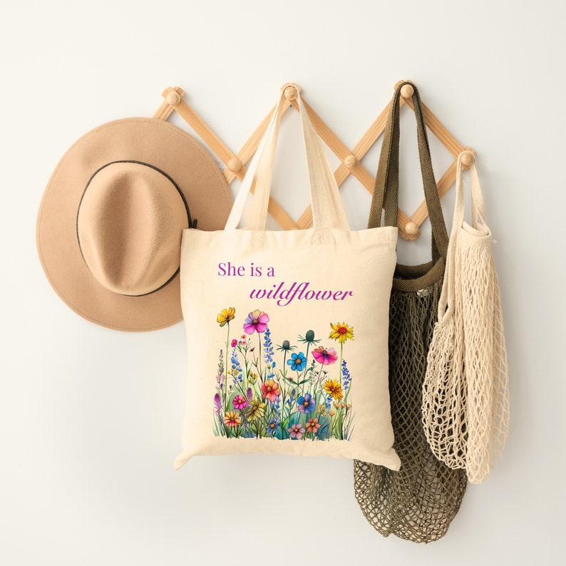 She is a wildflower, The Daisy Exchange, Gifts for her, bestie gifts, birthday gifts, best selling items, bridesmaid tote, embroidered tote, floral backpack, weekend bag, christian tote, farmers market bag, floral botanical canvas bag, everyday tote