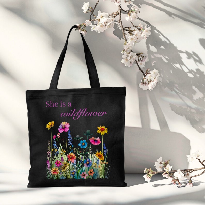 She is a wildflower, The Daisy Exchange, Gifts for her, bestie gifts, birthday gifts, best selling items, bridesmaid tote, embroidered tote, floral backpack, weekend bag, christian tote, farmers market bag, floral botanical canvas bag, everyday tote