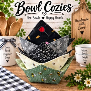 May include: A stack of four fabric bowl cozies featuring various patterns including wine glasses on black, floral gray, small black and white flowers, and bees on light green and cream backgrounds, with text reading Bowl Cozies Hot Bowls Happy Hands.