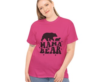 May include: A pink t-shirt with a black graphic of a mama bear and two cubs walking. The text "mama bear" is written in a retro font with stars around it.