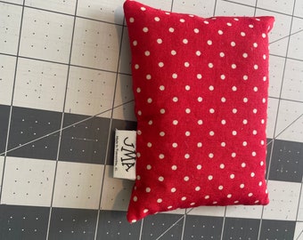 May include: Red and white polka dot fabric pillow with a white label that says "JMA Made in Tuscaloosa, AL."