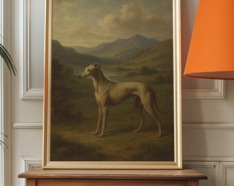 May include: A framed painting depicting a greyhound dog in a landscape setting. The artwork shows a slender dog in a field with mountains in the background. The frame is gold, and the painting is displayed on a wooden table.
