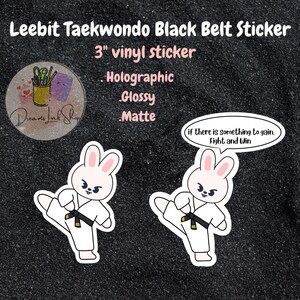 May include: A 3-inch vinyl sticker featuring a cartoon bunny in a white taekwondo uniform performing a kick. The bunny has pink ears and a black belt. The sticker has a speech bubble that says "if there is something to gain, fight and win".