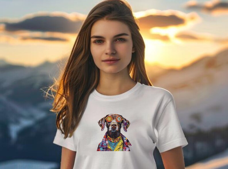May include: A white t-shirt with a colorful graphic of a dog wearing sunglasses. The dog is wearing a colorful patterned shirt and has a yellow background.