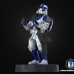 May include: A detailed figurine of a character in a white and blue armored suit, with a helmet and a satchel. The figure is standing on a dark grey base. The armour has intricate details and is posed with its hands up. The overall theme is science fiction.