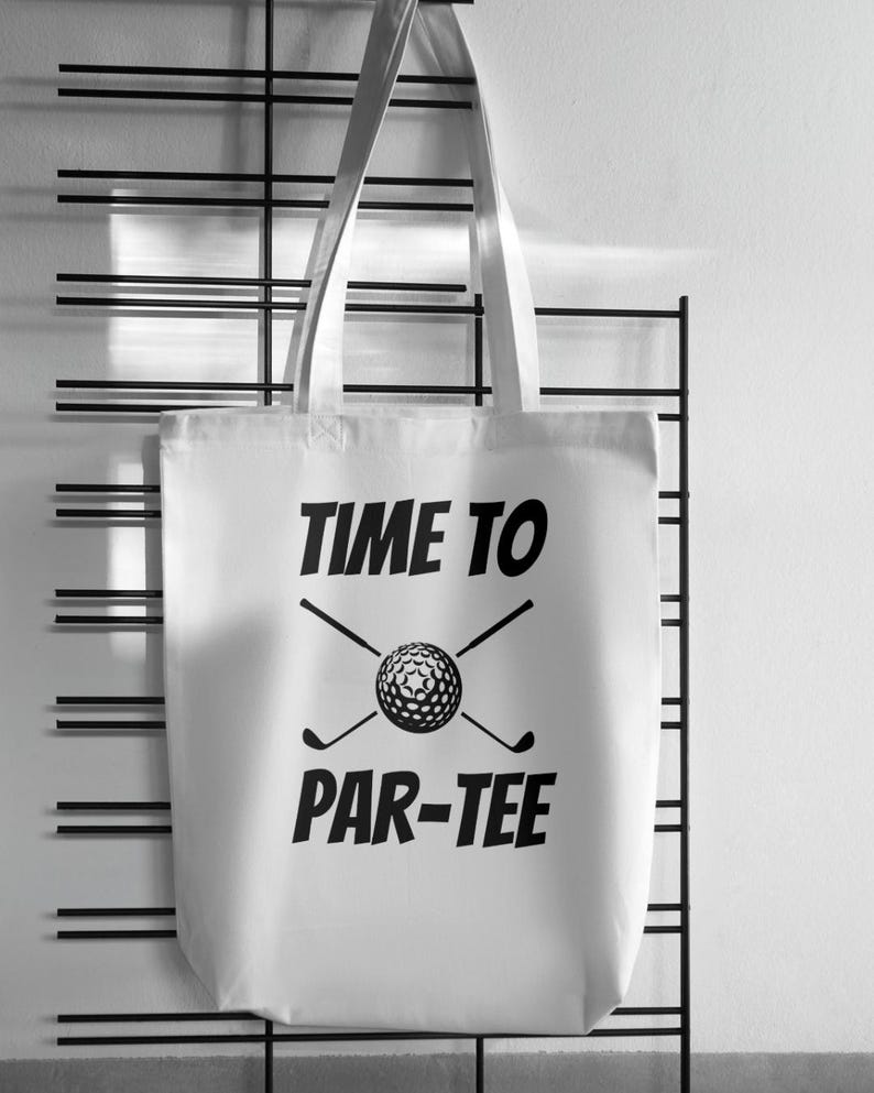 May include: White canvas tote bag with black text that reads "Time to Par-Tee" and a golf ball and crossed golf clubs graphic.