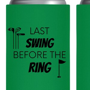 May include: Green can cooler with black text that reads "Last Swing Before The Ring". There are golf club and flag graphics on the cooler.