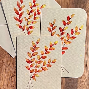 Cartões de saudação florais metálicos
