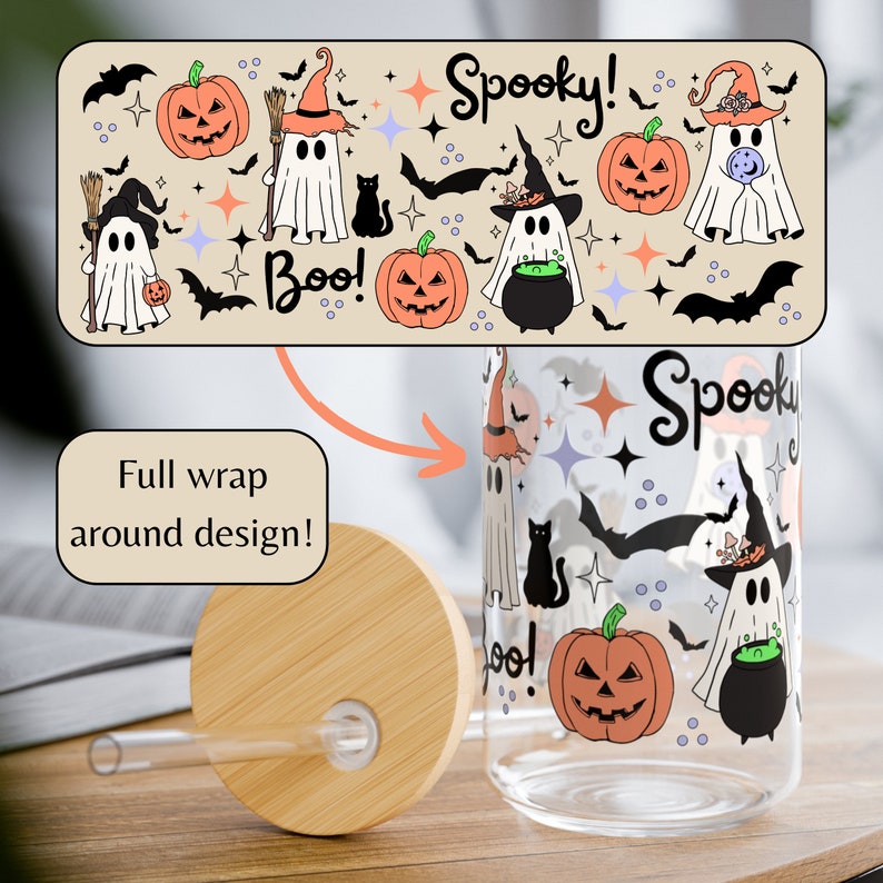 May include: A clear glass water bottle with a bamboo lid and straw. The bottle has a full wrap design featuring ghosts, bats, pumpkins, stars, and the text "Spooky!" and "Boo!"
