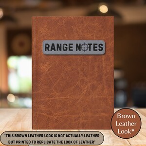 May include: A brown leather-look notebook with the text "RANGE NOTES" and a target symbol on a gray patch. The text "THIS BROWN LEATHER LOOK IS NOT ACTUALLY LEATHER BUT PRINTED TO REPLICATE THE LOOK OF LEATHER" is printed below the notebook.