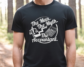 May include: Black t-shirt with a white graphic design that says "The Man. The Myth. The Accountant." The graphic includes a scale, a staircase, and a calculator.