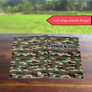 May include: A green, brown, and tan camouflage notebook with a gray label that says "RANGE NOTES". The notebook is open and the cover is wrapped in the camouflage pattern. The text "Full wrap around design!" is written in red on a white arrow.