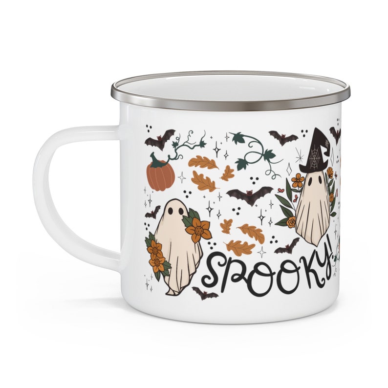 May include: White enamel mug with a spooky Halloween design featuring ghosts, bats, pumpkins, and leaves. The text "Spooky!" is written in black cursive.