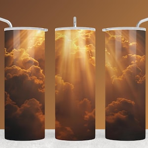May include: Three stainless steel tumblers with a celestial design. The design features a dramatic image of golden sunlight streaming through fluffy, dark orange clouds. Each tumbler has a silver lid and a silver straw.
