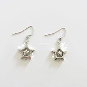 y2k silver star earrings | swirly whimsygothic space earrings | edgy punk star charm hoops | cyber grunge dangly star charm jewelry | gifts