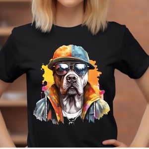 May include: A black t-shirt with a colorful illustration of a pit bull wearing sunglasses and a baseball cap. The dog is wearing a jacket and has a chain necklace.