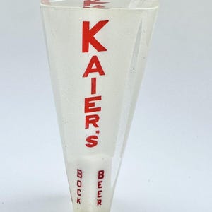 May include: A clear plastic beer tap handle with red lettering that reads "KAIER'S" and "BEER" and "BOCK" on the bottom.