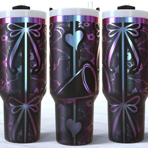 May include: Three stainless steel tumblers with a black and iridescent finish. The tumblers feature a design of a bow with a lace pattern.