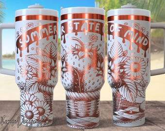 May include: White and copper-colored travel mug with a handle, featuring a strawberry and floral design. The text "SUMMER STATE OF MIND" is displayed across the top. The mug has a white lid and a white handle.