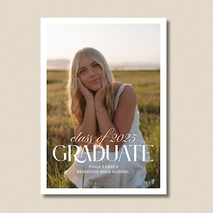 May include: A graduation announcement featuring a young woman in a white dress, seated in a field of tall grass. The text reads "class of 2025 GRADUATE" with the graduate's name and high school below. The background shows a sunset.