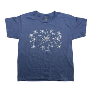 May include: A navy blue t-shirt with a white graphic of a large star surrounded by smaller stars. The text "CHILL'S APPAREL" is printed on the graphic.