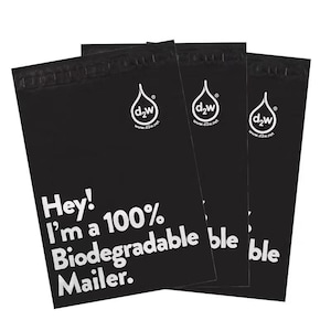 May include: Three black biodegradable mailers with the text "Hey! I'm a 100% Biodegradable Mailer." and a white logo with the text "d2w" and "www.d2w.net".