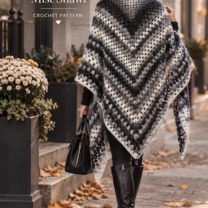 May include: A triangular crochet shawl featuring a gradient pattern of black, grey, and white yarn. The text "The Amberwood Mist Shawl CROCHET PATTERN" is visible at the top, and "CROCHET PATTERN HOUSE" is printed at the bottom of the image.