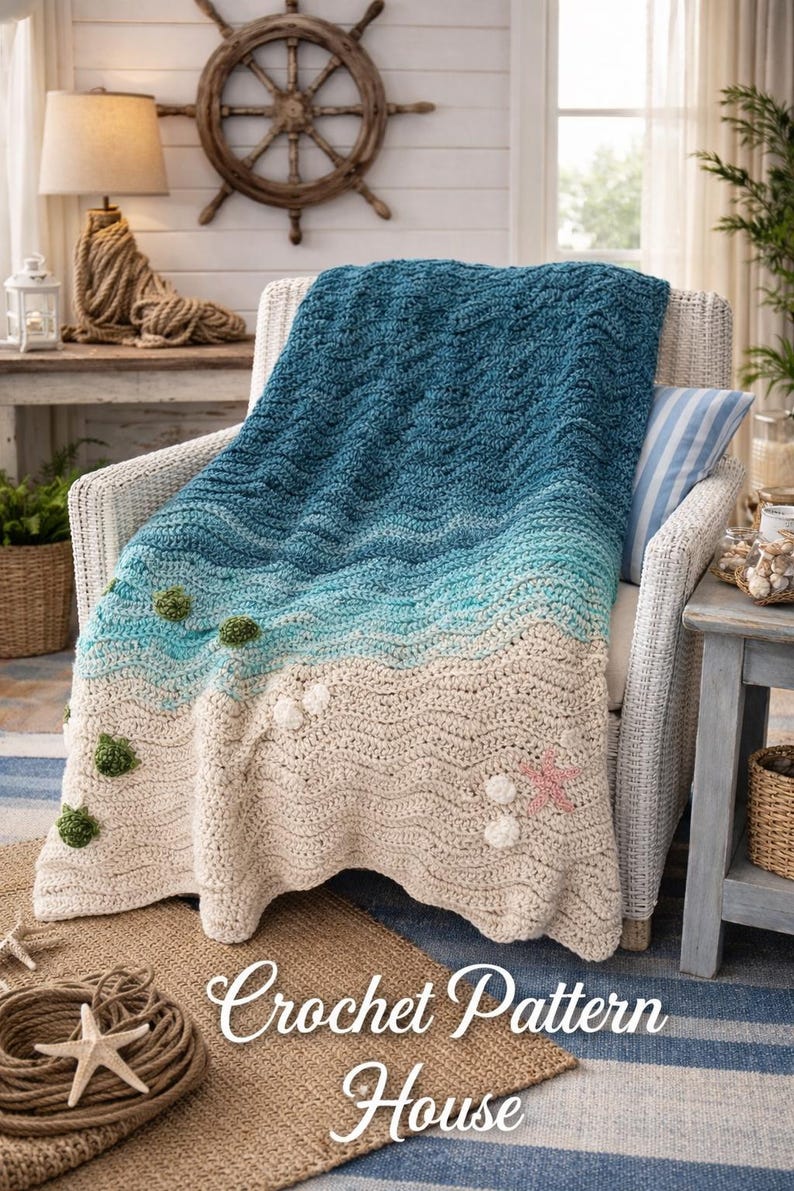 May include: A handmade crochet blanket in shades of blue, turquoise, and beige, resembling a beach scene. The blanket features wave-like patterns, with decorative elements like green pom-poms and a pink starfish. The text "Crochet Pattern House" is visible.