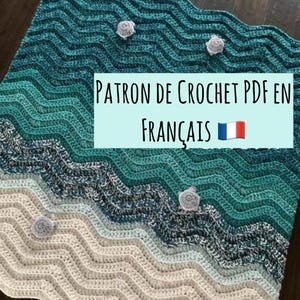 May include: A crochet blanket featuring a wavy chevron pattern in shades of teal, blue, and cream, accented with four small white crocheted turtle appliqués. The image includes the text PATRON DE CROCHET PDF EN FRANÇAIS with a French flag icon.